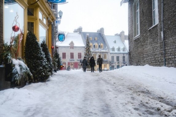 A charming winter scene in Old Quebec, with historic buildings and snow-covered streets, providing the perfect romantic atmosphere for a hand-in-hand Valentine's Day stroll.